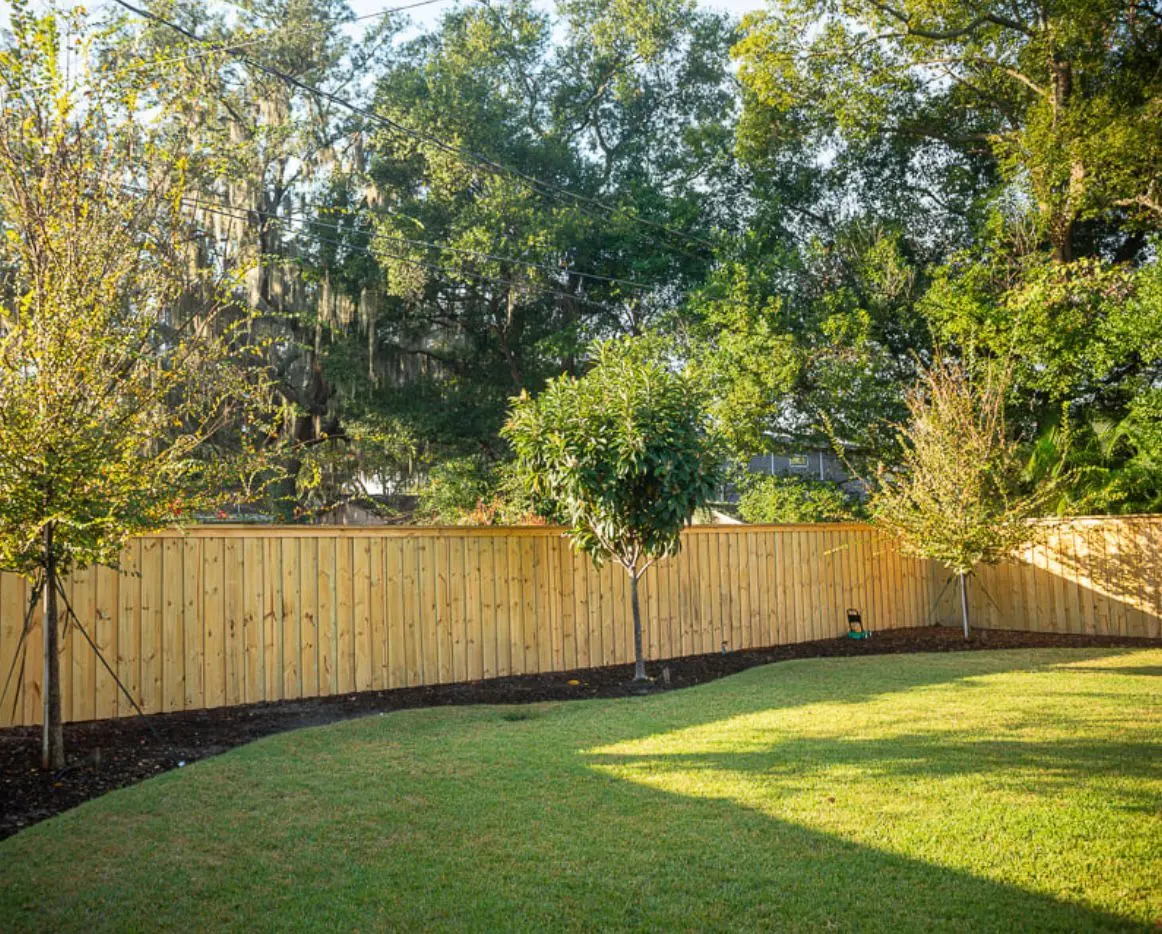 Finished lawn and wood fence project